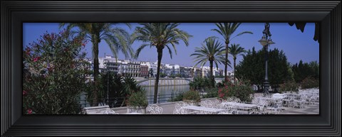 Framed Sidewalk cafe at the riverside, Guadalquivir River, Seville, Spain Print
