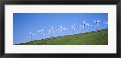Framed Low angle view of wind turbines on a hill, Altamont Pass, California, USA Print