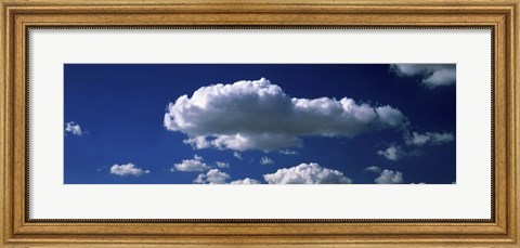 Framed Fluffy clouds in blue sky Print