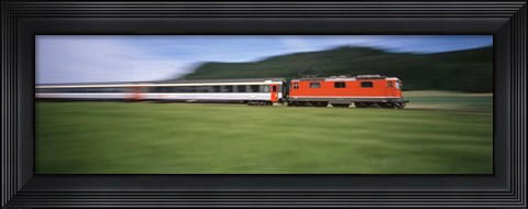 Framed Train moving on a railroad track Print