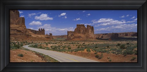 Framed Empty road running through a national park, Arches National Park, Utah, USA Print