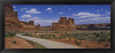 Framed Empty road running through a national park, Arches National Park, Utah, USA Print