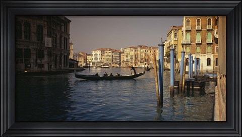 Framed Tourists sitting in a gondola, Grand Canal, Venice, Italy Print