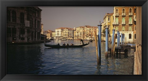 Framed Tourists sitting in a gondola, Grand Canal, Venice, Italy Print