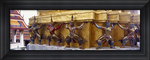 Framed Statues at base of golden chedi, The Grand Palace, Bangkok, Thailand Print