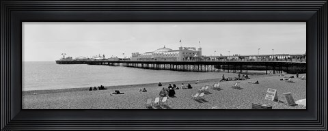 Framed Tourists on the beach, Brighton, England Print