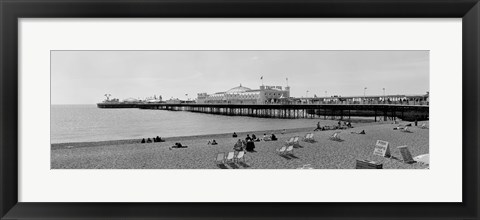 Framed Tourists on the beach, Brighton, England Print