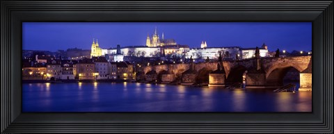 Framed Bridge across a river lit up at night, Charles Bridge, Vltava River, Prague, Czech Republic Print