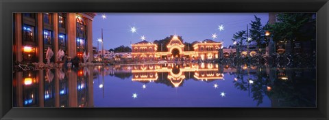 Framed Buildings in an amusement park lit up at dusk, Tivoli Gardens, Copenhagen, Denmark Print