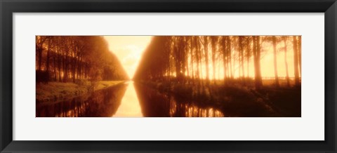 Framed Belgium, tree lined waterway through countryside, sepia tone Print