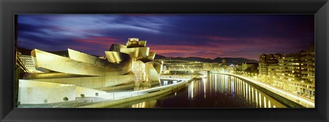 Framed Buildings lit up at dusk, Guggenheim Museum Bilbao, Bilbao, Vizcaya, Spain Print