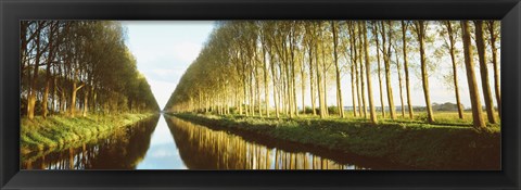 Framed Belgium, tree lined waterway through countryside Print