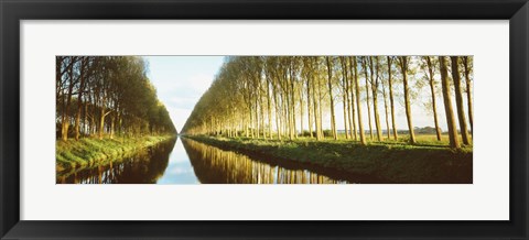 Framed Belgium, tree lined waterway through countryside Print