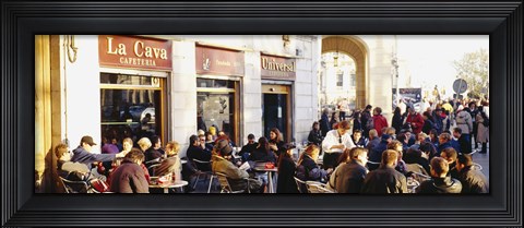 Framed Tourists sitting outside of a cafe, Barcelona, Spain Print