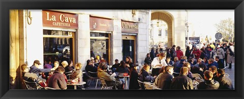 Framed Tourists sitting outside of a cafe, Barcelona, Spain Print