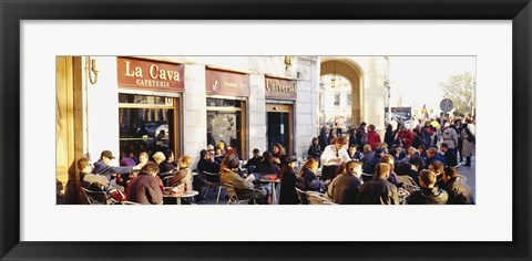 Framed Tourists sitting outside of a cafe, Barcelona, Spain Print