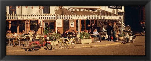 Framed Tourists sitting in a cafe, Sitges Beach, Catalonia, Spain Print