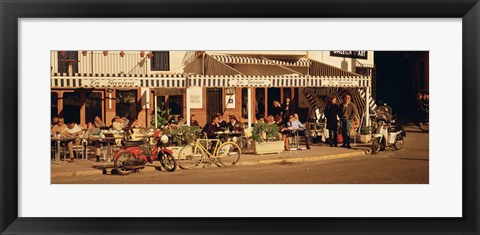 Framed Tourists sitting in a cafe, Sitges Beach, Catalonia, Spain Print