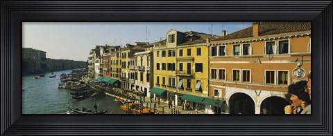 Framed Tourists looking at gondolas in a canal, Venice, Italy Print