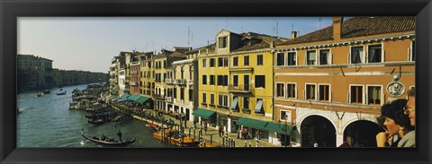 Framed Tourists looking at gondolas in a canal, Venice, Italy Print