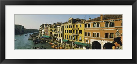 Framed Tourists looking at gondolas in a canal, Venice, Italy Print