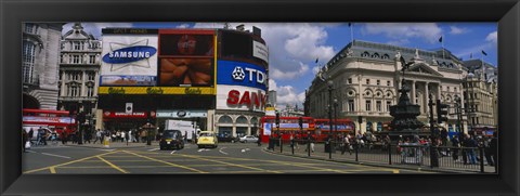 Framed Commercial signs on buildings, Piccadilly Circus, London, England Print