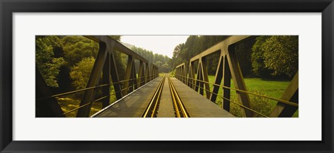 Framed Railroad tracks passing through a bridge, Germany Print