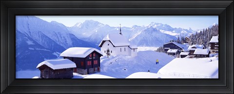 Framed Snow Covered Chapel and Chalets Swiss Alps Switzerland Print