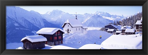 Framed Snow Covered Chapel and Chalets Swiss Alps Switzerland Print