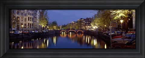 Framed Night View Along Canal Amsterdam The Netherlands Print