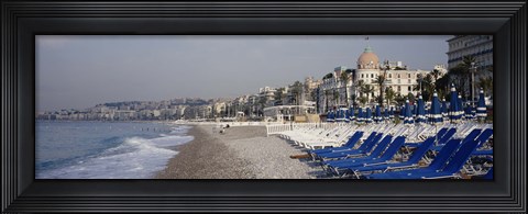 Framed Empty lounge chairs on the beach, Nice, French Riviera, France Print