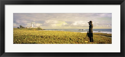 Framed USA, California, Businessman standing holding binoculars and looking at the lighthouse Print