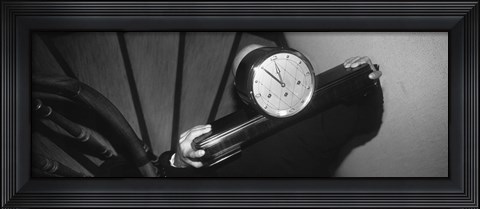 Framed Man Carrying Clock Up Stairs On Shoulders Print