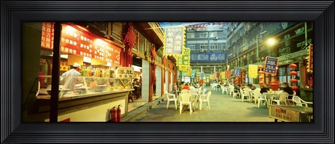 Framed Group of people sitting outside a restaurant, Beijing, China Print