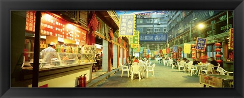 Framed Group of people sitting outside a restaurant, Beijing, China Print