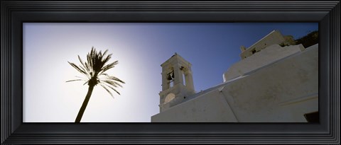 Framed Low angle view of a palm tree near a church , Ios, Cyclades Islands, Greece Print