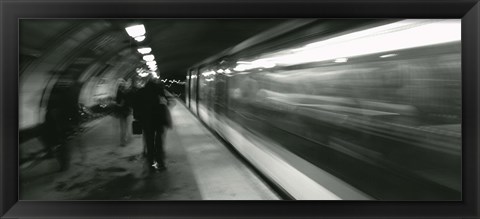 Framed Subway train passing through a subway station, London, England Print