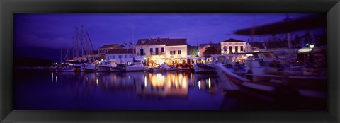 Framed Greece, Cephalonia, Light illuminated on harbor and outdoors cafe Print