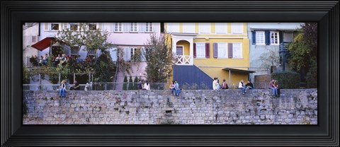 Framed Low Angle View Of A Group Of People Sitting On A Wall, Tubingen, Baden-Wurttemberg, Germany Print
