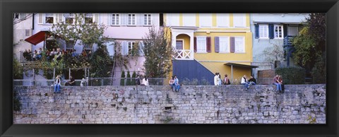 Framed Low Angle View Of A Group Of People Sitting On A Wall, Tubingen, Baden-Wurttemberg, Germany Print