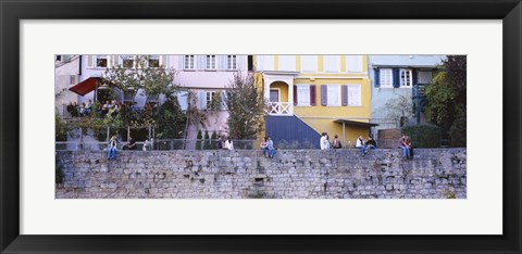 Framed Low Angle View Of A Group Of People Sitting On A Wall, Tubingen, Baden-Wurttemberg, Germany Print