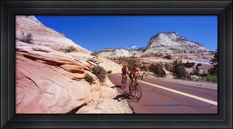 Framed Two people cycling on the road, Zion National Park, Utah, USA Print