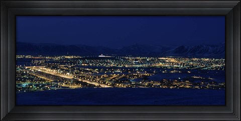 Framed High angle view of city lit up at night, Reykjavik, Iceland Print