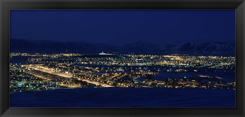 Framed High angle view of city lit up at night, Reykjavik, Iceland Print