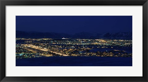 Framed High angle view of city lit up at night, Reykjavik, Iceland Print