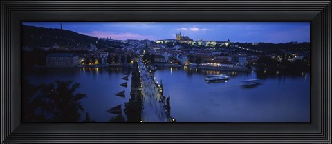 Framed High angle view of buildings lit up at dusk, Charles Bridge, Vltava River, Prague, Czech Republic Print