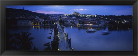 Framed High angle view of buildings lit up at dusk, Charles Bridge, Vltava River, Prague, Czech Republic Print