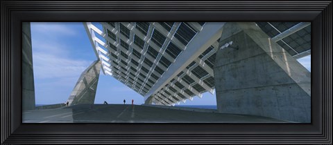 Framed Four people under a structure, Barcelona, Catalonia, Spain Print