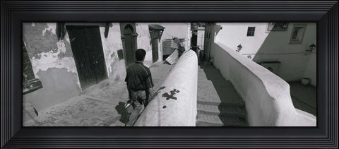 Framed Rear view of a man walking in front of a building, Casaba, Algiers, Algeria Print
