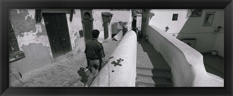 Framed Rear view of a man walking in front of a building, Casaba, Algiers, Algeria Print